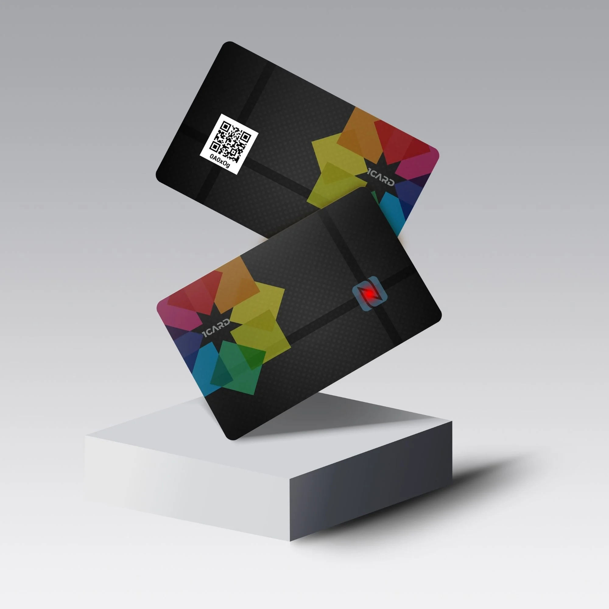 Two black 1Card Glow Red LED cards with colorful geometric designs and a QR code, displayed on a white pedestal.
